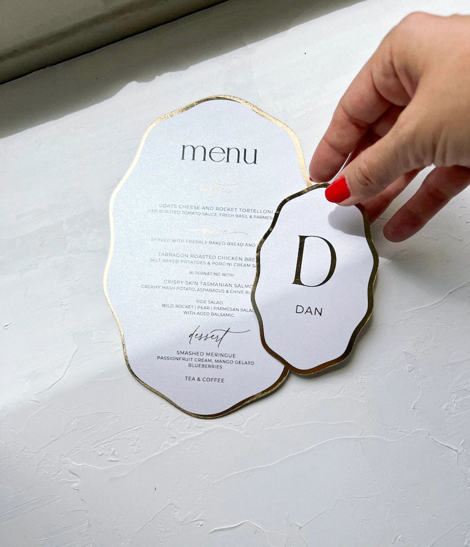 Cloud-shaped wedding menu with gold foil edges and matching monogram place card for Dan, hand-finished on premium cardstock