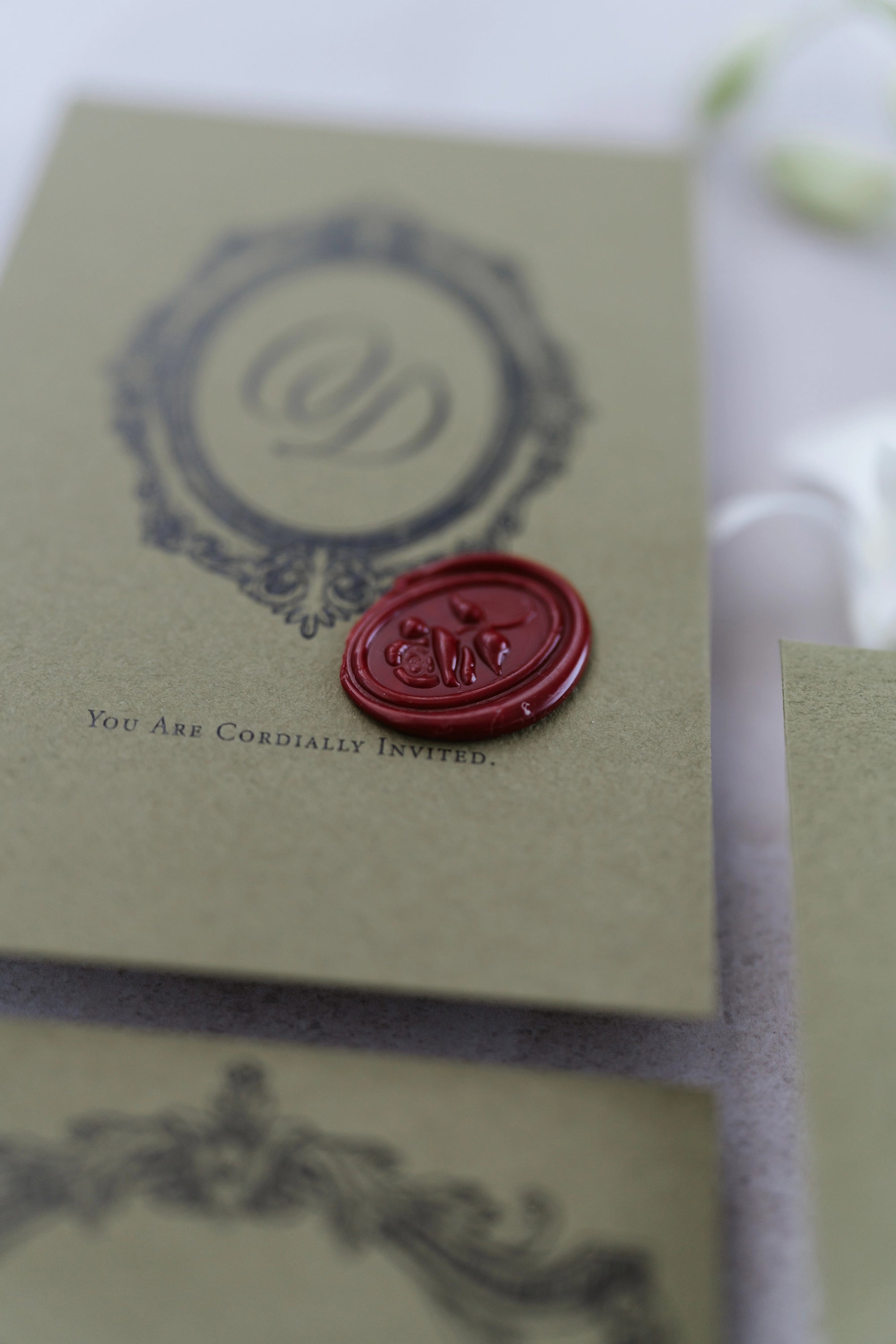 The Bordeaux Suite olive green save the date with ornate vintage frame OD monogram and red wax seal by Felicitations