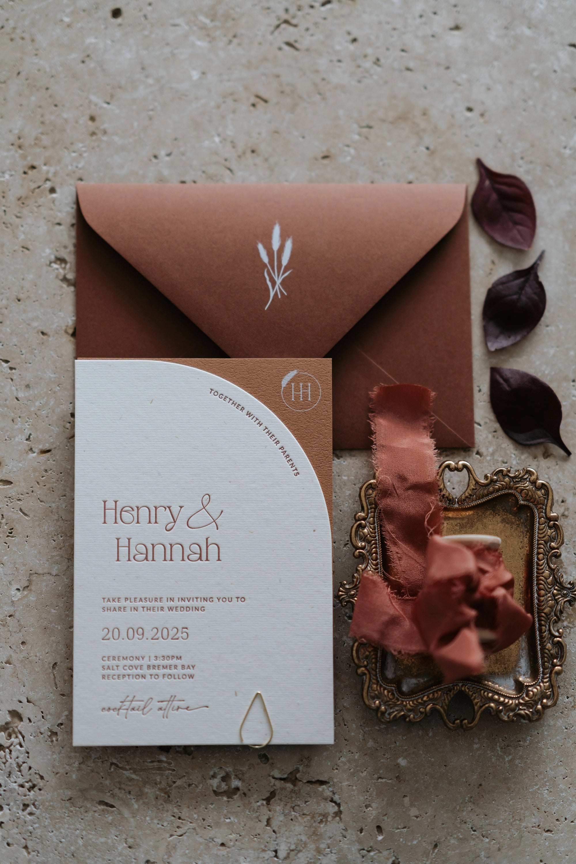 The Seville Suite arch wedding invitation in cream and rust for Henry and Hannah with terracotta envelope and silk ribbon by Felicitations