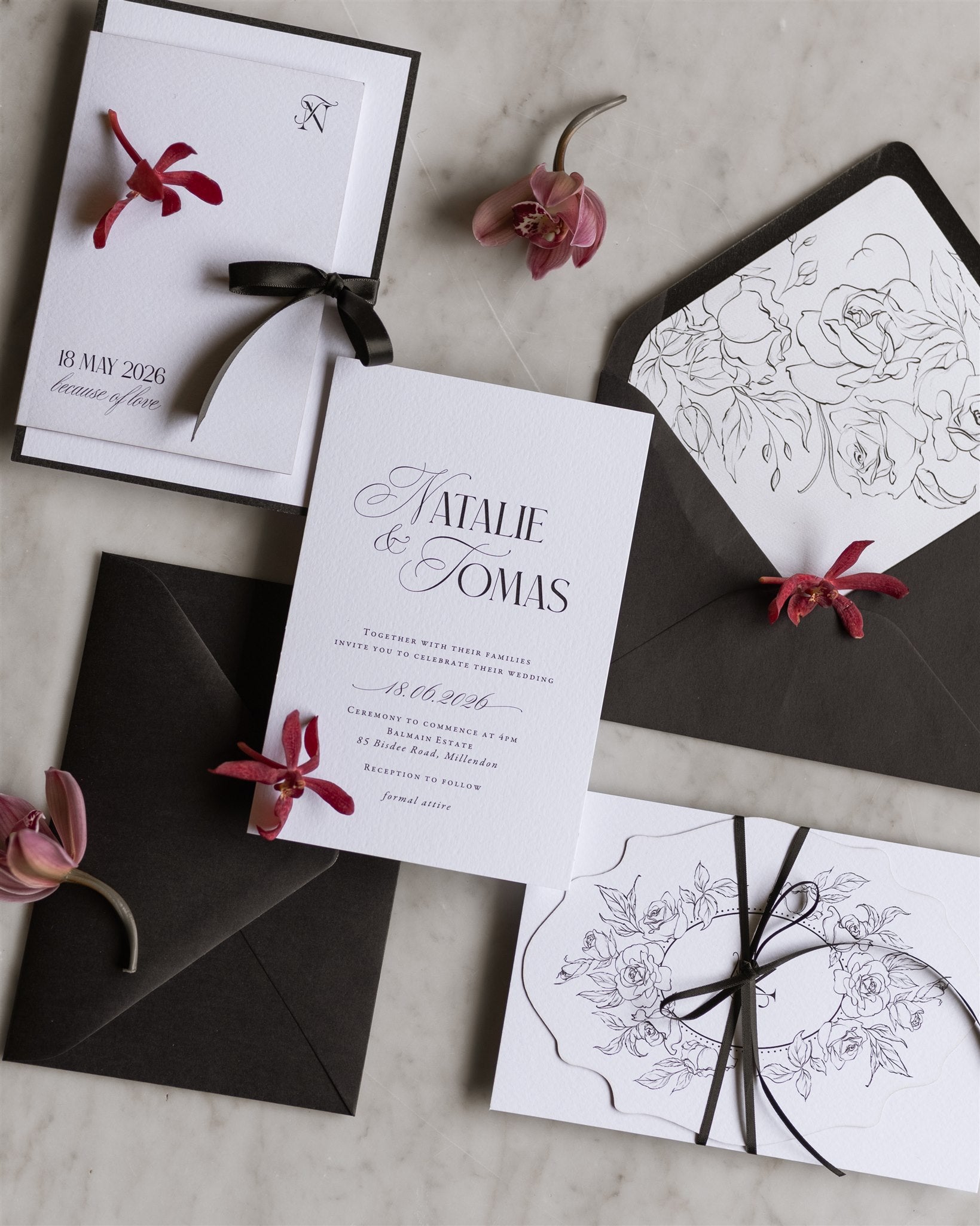 The Verona Suite white wedding invitation with N monogram Save the Date and dark envelope with botanical line illustration liner by Felicitations