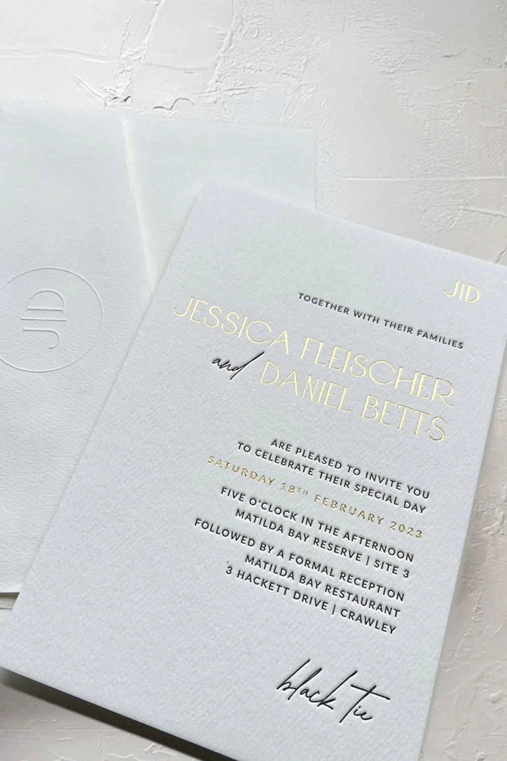 Refined wedding invitation printed with luxurious letterpress and gold foil on textured cardstock, paired with a custom monogram-embossed envelope, designed by Felicitations Perth for an elegant black-tie celebration.