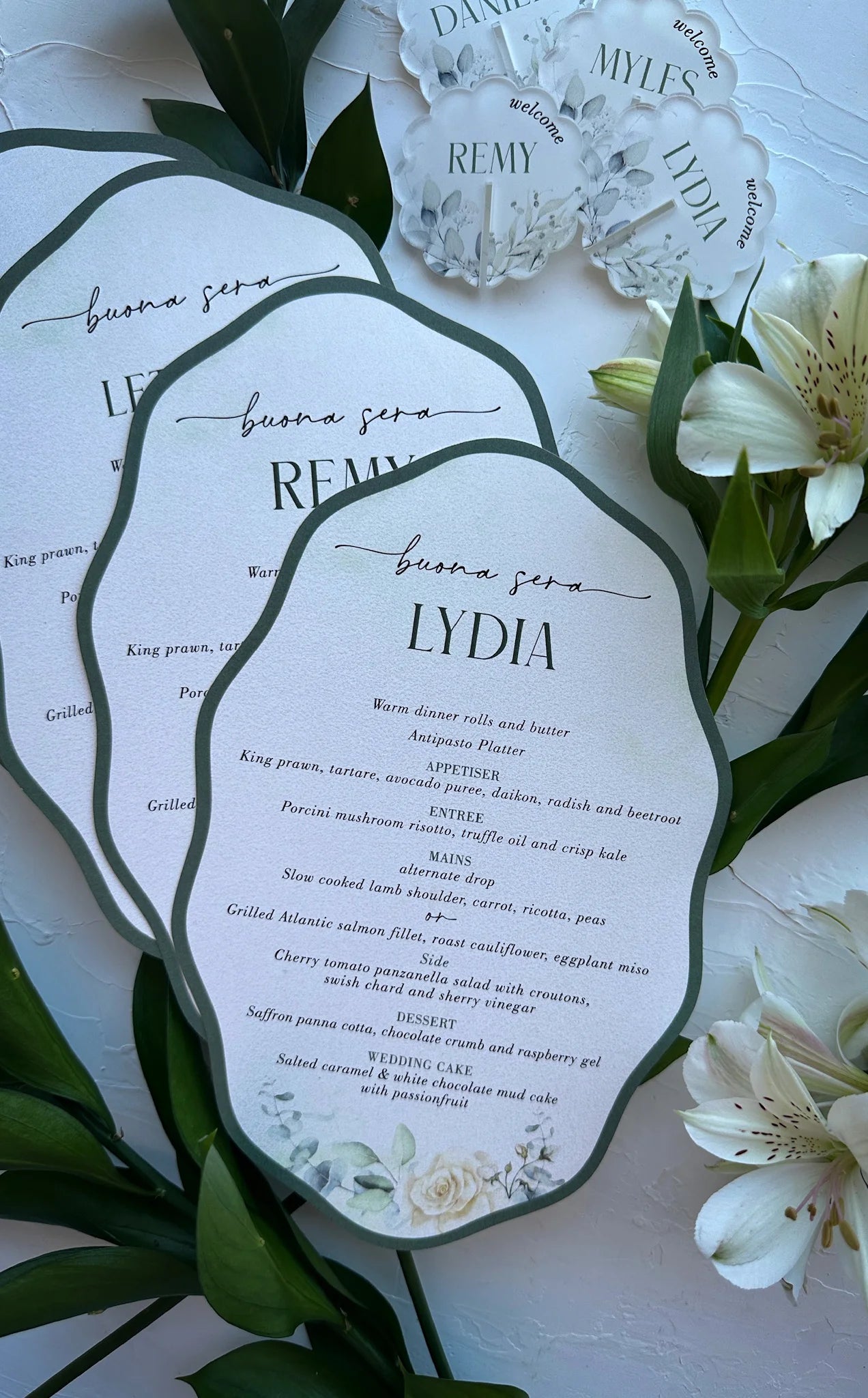 The Sintra Suite Buona Sera personalised wedding menu cards with green wavy edges for guests by Felicitations