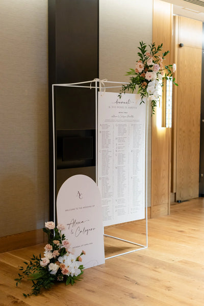 Italian wedding welcome and seating chart signs for Alexia and Calogero, styled with blush roses, white orchids and greenery