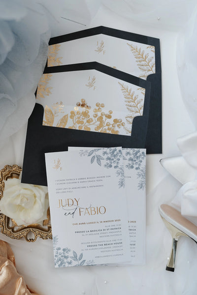 The Geneva Suite wedding invitations with black envelopes featuring gold foil leaf and berry illustrations by Felicitations