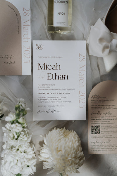 The Matera Suite cream wedding invitation for Micah and Ethan with Aloft Perth ceremony details and arch finer details card by Felicitations