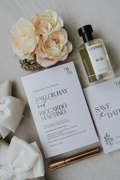 The Paris wedding invitation paired with arch save the date, white satin bow heel and cream roses on stone background — Taylor Hay and Riccardo Martino suite