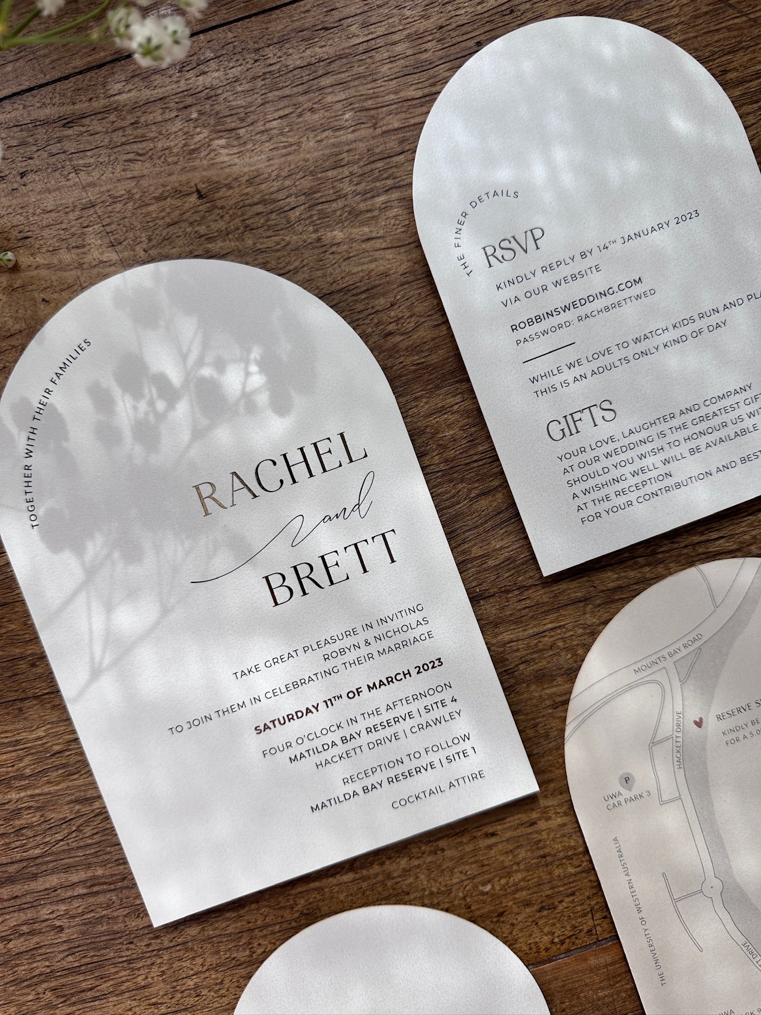 The Santorini Suite shimmer arch wedding invitation with finer details RSVP card and circular map card by Felicitations