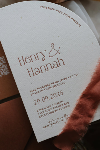 The Seville Suite arch invitation close up with QR code and rust ribbon by Felicitations Wedding Stationery