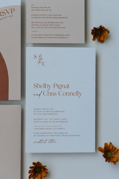 The Siena Suite main invitation card with SC monogram in terracotta script by Felicitations