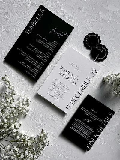 The St Moritz Suite black and white wedding invitation flat lay for Jessica and Nicholas with finer details and lets do this drink coasters by Felicitations