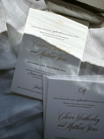 The Venice Suite traditional wedding invitations with gold foil calligraphy on neutral linen background by Felicitations