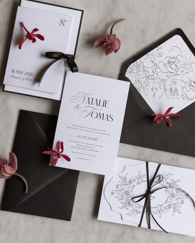 The Verona Suite white wedding invitation with N monogram Save the Date and dark envelope with botanical line illustration liner by Felicitations