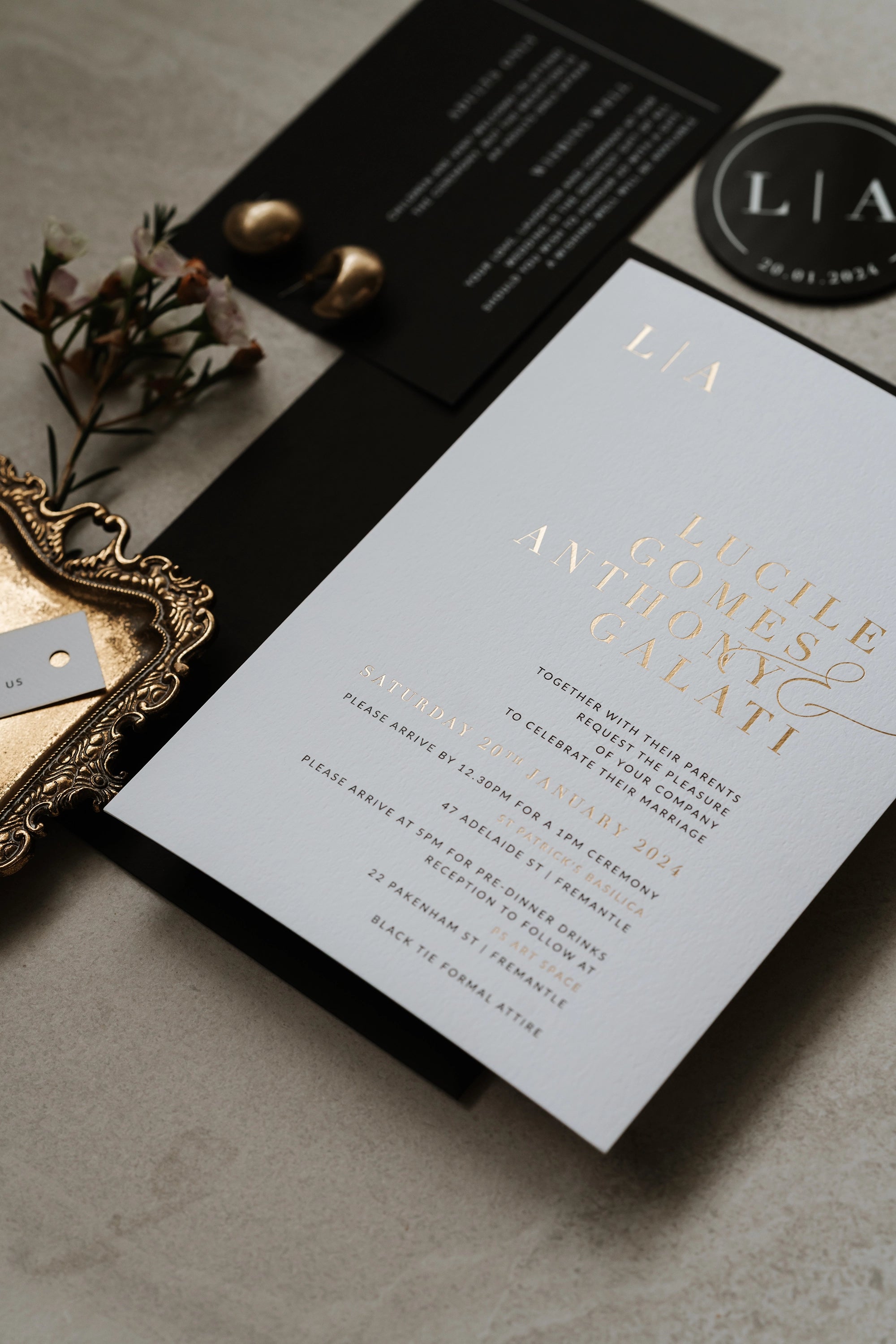 The Zurich Suite white wedding invitation with gold foil typography for Lucile and Anthony with black save the date and circular monogram by Felicitations