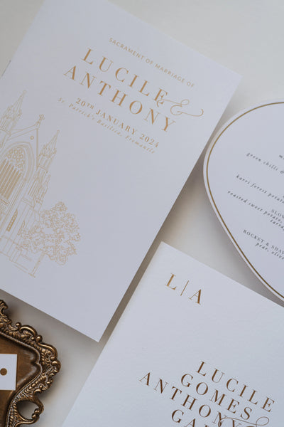 The Zurich Suite ceremony booklet detail with church illustration and gold foil typography by Felicitations Wedding Stationery
